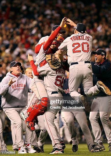 Curt Schilling , Kevin Youkilis, Jonathan Papelbon and Jason Varitek of the Boston Red Sox celebrate after winning Game Four by a score of the 4-3 to...