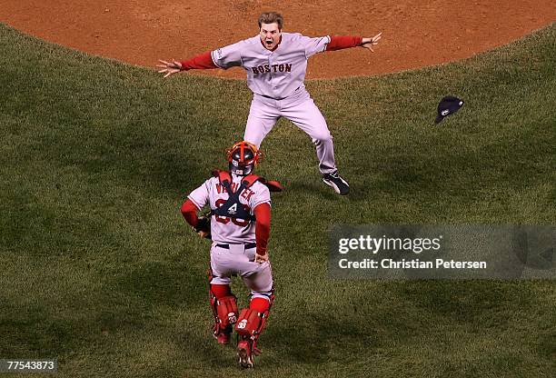 Relief pitcher Jonathan Papelbon of the Boston Red Sox celebrates with Jason Varitek after defeating the Colorado Rockies in Game Four of the 2007...