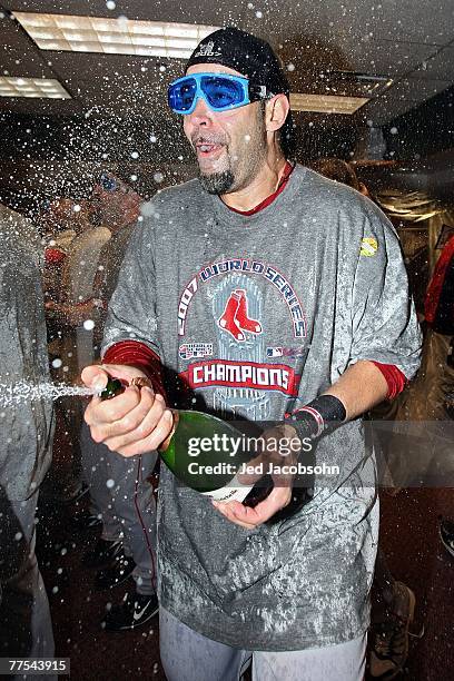 Mike Lowell of the Boston Red Sox celebrates with champagne in the locker room after winning Game Four by a score of the 4-3 to win the 2007 Major...