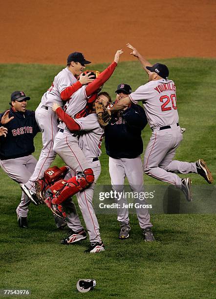 Josh Beckett, Jonathan Papelbon, Jason Varitek and Kevin Youkilis of the Boston Red Sox celebrate after winning Game Four by a score of the 4-3 to...