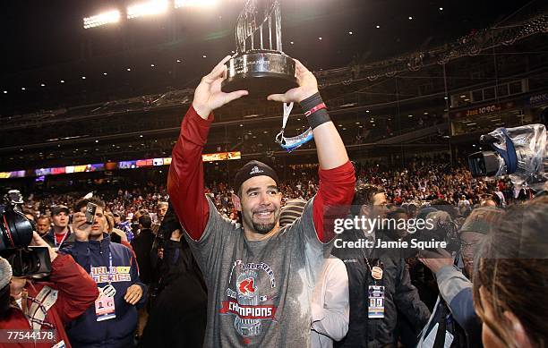 Mike Lowell of the Boston Red Sox holds the MVP trophy after the Red Sox won Game Four by a score of the 4-3 to win the 2007 Major League Baseball...