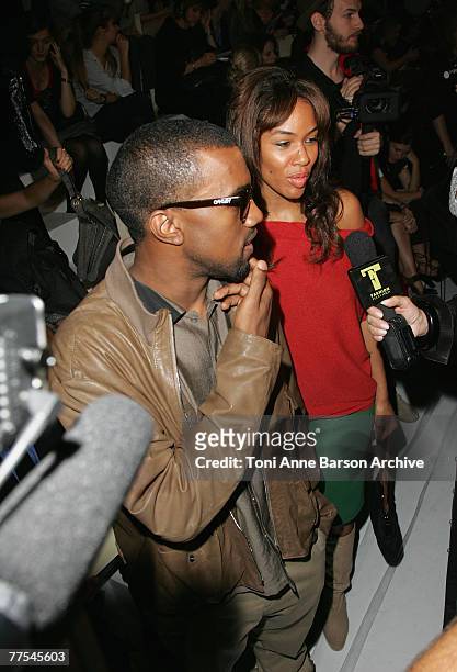 Kanye West and Alexis Phifer arrive at the Stella McCartney Fashion Show on October 4th, 2007 in Paris.