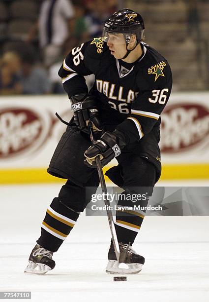 Jussi Jokinen of the Dallas Stars skates with the puck against the Phoenix Coyotes during a preseason game at American Airlines Center on September...