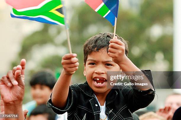 Fans celebrate South Africa winning the 2007 Rugby World Cup during a ticker tape parade on 29 October, 2007 in Cape Town, South Africa.