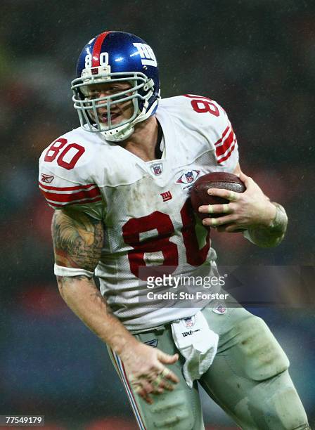 Giants Tight End, Jeremy Shockey carries the ball during the NFL Bridgestone International Series match between New York Giants and Miami Dolphins at...