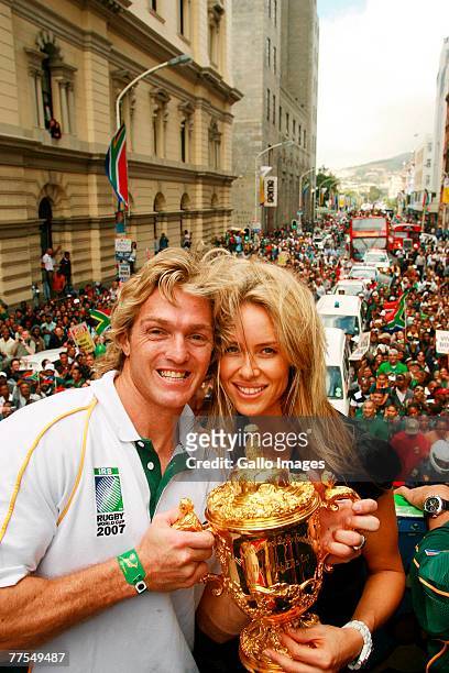 Percy Montgomery and his wife Tamsin celebrate South Africa winning the 2007 Rugby World Cup with the WIlliam Webb Ellis Trophy during a ticker tape...