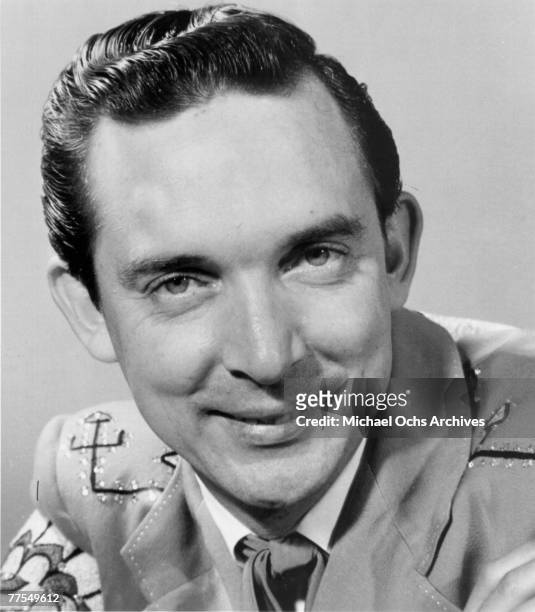Country singer Ray Price poses for a portrait wearing a coat designed by Nudie Cohn in circa 1957.