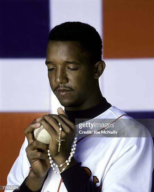 Pedro Martinez poses in front of the Dominican Republic flag in march of 1998 in Miami, Florida. Martinez has three Cy Young Awards to his credit and...