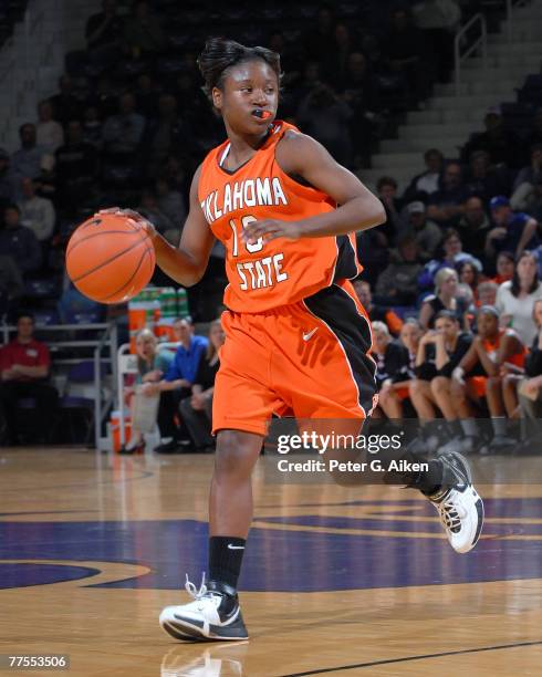 Oklahoma State guard Andrea Riley brings the ball up court against Kansas State, during first half action at Bramlage Coliseum in Manhattan, Kansas,...