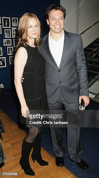 Actress Laura Linney and Marc Schauer arrives at the premiere of Savages at Odeon Leicester Square during the BFI 51st London Film Festival on...