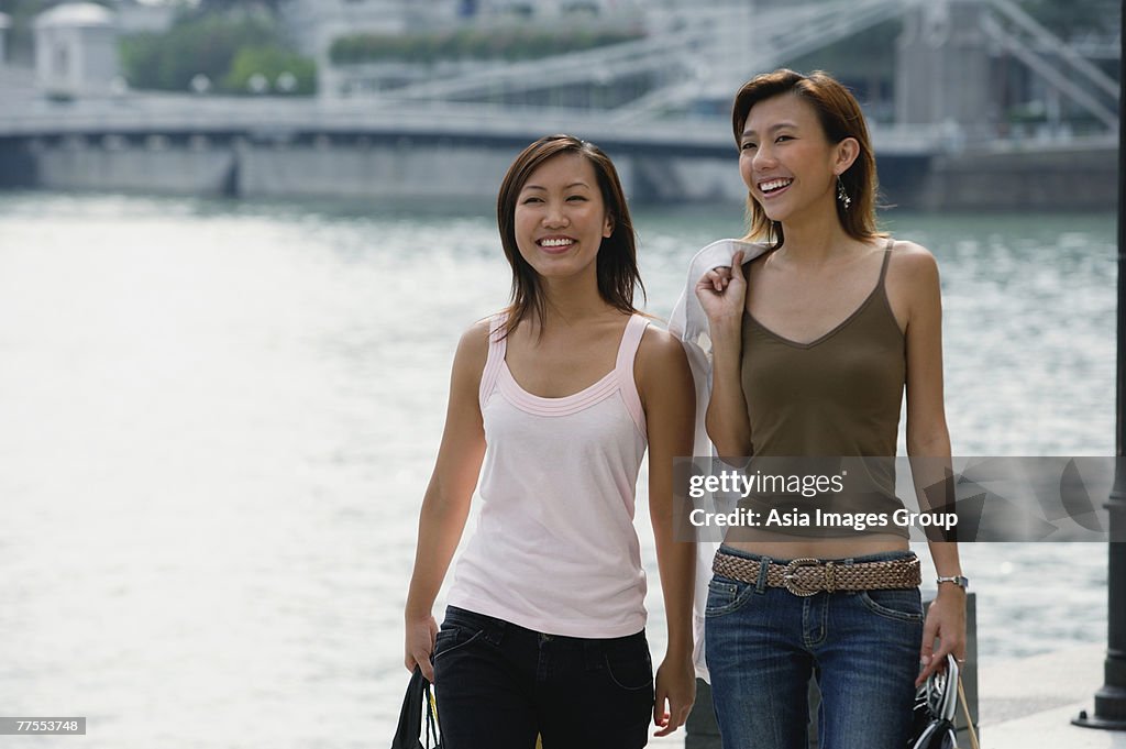 Two women walking side by side