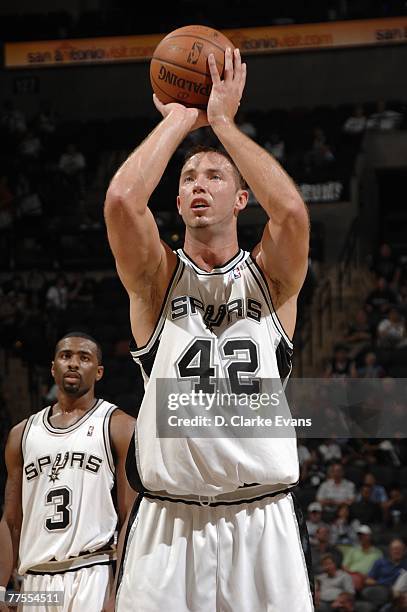 Kris Lang of the San Antonio Spurs shoots a free throw during a preseason game against the Detroit Pistons at AT&T Center on October 20, 2007 in San...