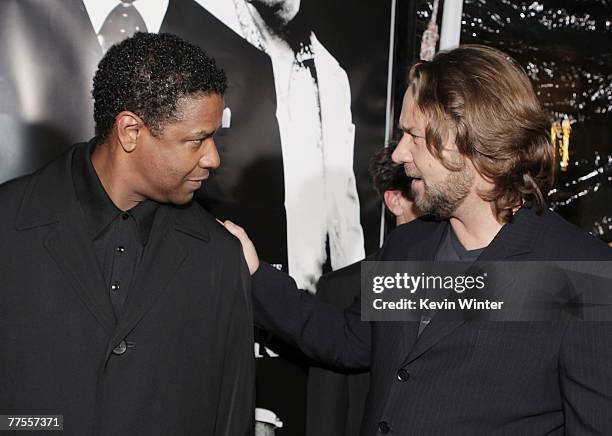 Actors Denzel Washington and Russell Crowe arrive at an industry screening of Universal Picture's and Imagine Entertainment's "American Gangster" at...