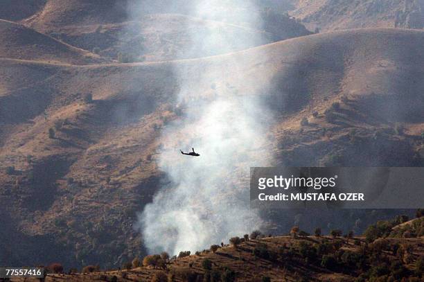 Turkish helicopters fly over the Cudi mountain during an attack on an outlawed Kurdistan Workers Party camp 30 October 2007 in the Cudi mountains,...