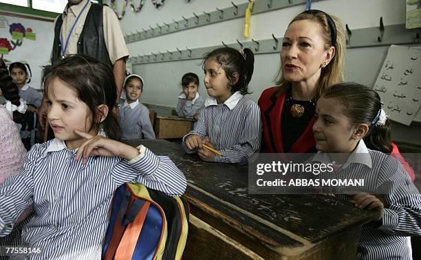 External Relations EU Commissioner Benita Ferrero-Waldner sits with girls at a school in the Qalandia Palestinian refugee camp close to the West Bank...