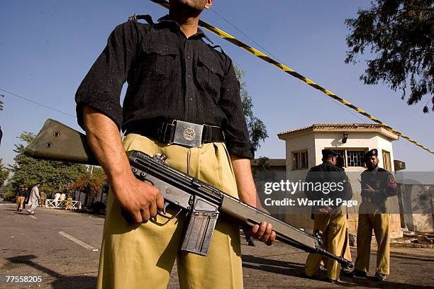 Police guard the site of a suicide bombing at an army checkpoint, October 30, Rawalpindi, Pakistan. At least six people were killed and 11 injured in...