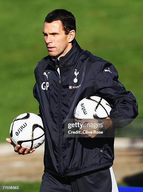 Gus Poyet of Tottenham Hotspur collects balls during a Tottenham Hotspur training session at the Spurs Lodge on October 30, 2007 in Chigwell, Essex.