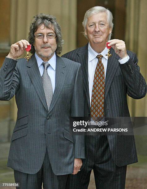 British TV writers Ian La Frenais and Richard Clement pose after both receiving their Officer of the British Empire from the Prince of Wales at...