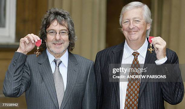 British TV writers Ian La Frenais and Richard Clement pose after both receiving their Officer of the British Empire from the Prince of Wales at...