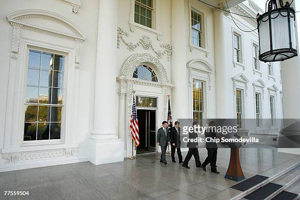 President George W. Bush walks out to address the news media after a closed-door meeting with Minority Deputy Whip Eric Cantor , Minority Whip Roy...