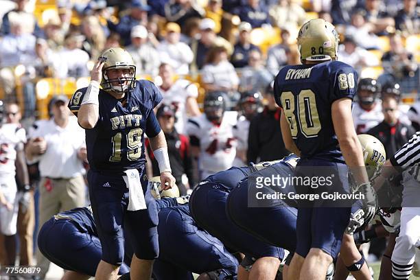 Quarterback Pat Bostick of the University of Pittsburgh Panthers signals to tight end Nate Byham during a Big East college football game against the...