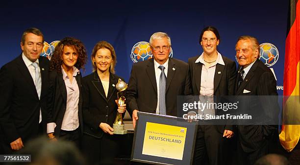 The General Secretary of the German fooball Federation Wolfgang Niersbach , German national football team player Fatmira Bajramaj, German Families...