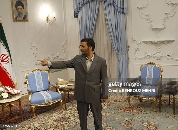 Iranian President Mahmoud Ahmadinejad gestures as he waits for the arrival of Russian Foreign Minister Sergei Lavrov in Tehran, 30 October 2007....