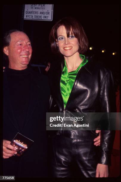 Actress Sigourney Weaver stands with her husband Jim Simpson at the premiere of the film "The Birdcage" March 3, 1996 in New York City. The movie,...