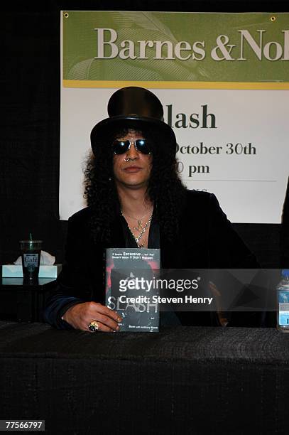 Musician Slash signs copies of his book "Slash" at Barnes and Noble at Astor Place on October 30, 2007 in New York City.