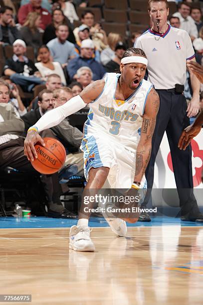 Allen Iverson of the Denver Nuggets makes a move with the ball during a preseason game against the Milwaukee Bucks at the Pepsi Center on October 23,...