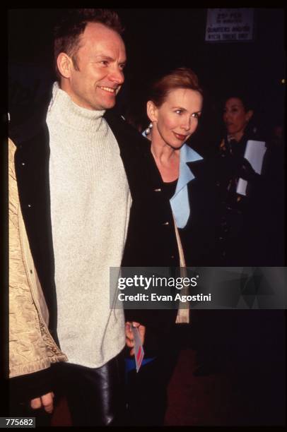 Musician Sting stands with a date at the premiere of the film "The Birdcage" March 3, 1996 in New York City. The movie, which stars Robin Williams...