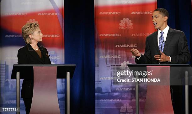 New York Senator Hillary Rodham Clinton listens as Illinois Senator Barack Obama speaks during the NBC Democratic Presidential Candidates Debate 30...