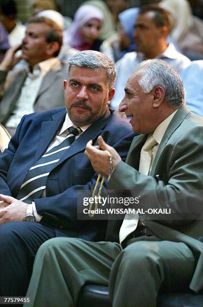 Iraqi member of parliament Falal Hassan Chanchal listens to a comrade during a meeting at Baghdad?s municipality building, 30 October 2007. Born in...