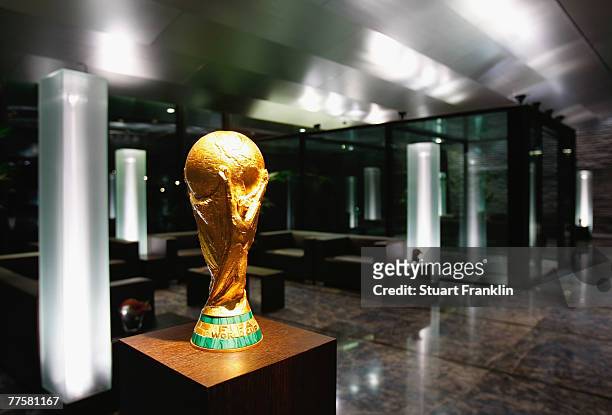 The FIFA World Cup trophy is displayed in the reception of the FIFA headquarters during the FIFA Executive Committee announcement for the host venue...
