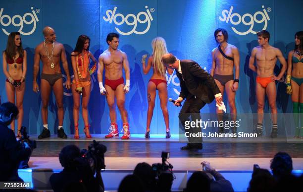 Former MTV VJ Ray Cokes checks the bottom of a finalist of the "Show Me Your Sloggi" Bottom World Championship at Reithalle on October 31, 2007 in...