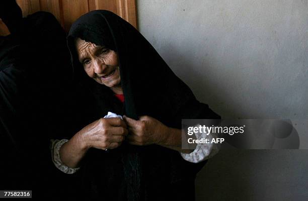 Palestinian mourner grieves during the funeral of Maher Abu Taer one of four fighters killed from Hamas' armed wing, the Ezzedine al-Qassam Brigades,...