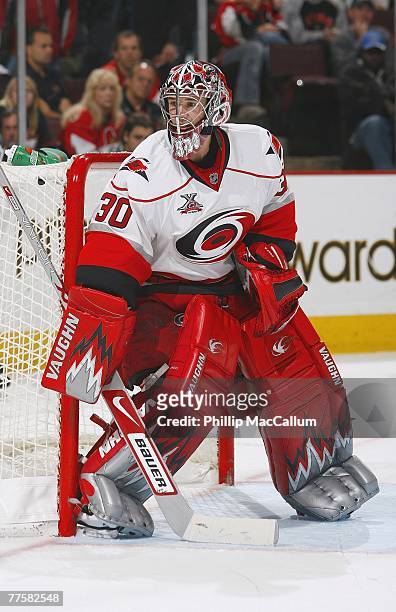 Cam Ward of the Carolina Hurricanes protects the goal during the NHL game against the Ottawa Senators at the Scotiabank Place on October 11, 2007 in...