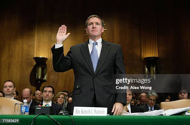 Assistant Attorney General Kenneth Wainstein of the National Security Division at U.S. Justice Department is sworn in during a hearing before the...