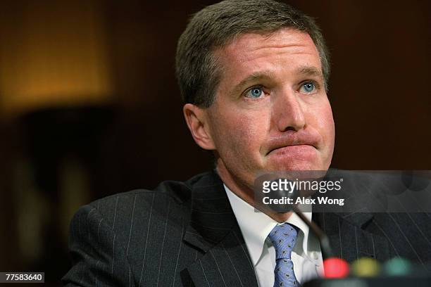 Assistant Attorney General Kenneth Wainstein of the National Security Division at U.S. Justice Department pauses as he testifies during a hearing...