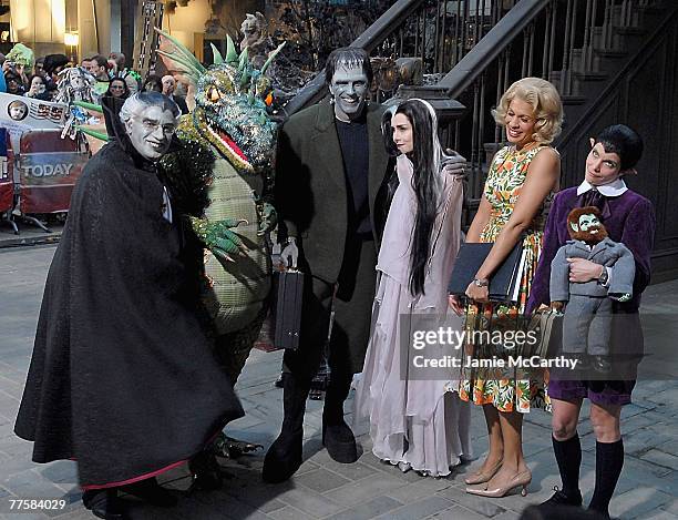 Al Roker dressed as Grandpa Munster, Tiki Barber dressed as Spot Munster, Matt Lauer dressed as Herman Munster,Meredith Vieira Dressed as Lilian...