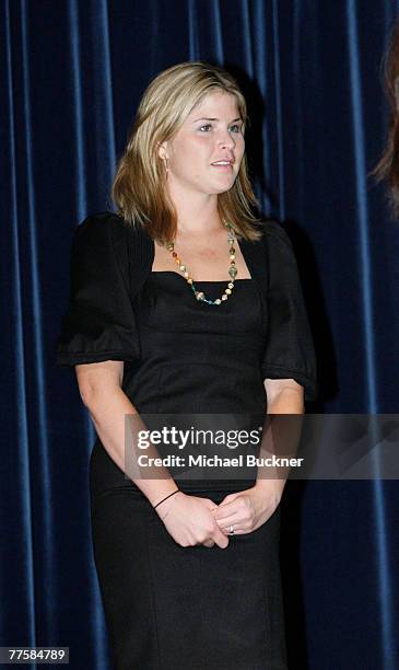 First Daughter Jenna Bush accepts a gift basket after speaking to high school members of the Key Club about her experiences volunteering for UNICEF...