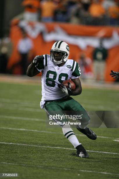 Wide Receiver Jerricho Cotchery of the New York Jets runs with the ball against the Cincinnati Bengals at Paul Brown Stadium in Cincinnati, Ohio on...