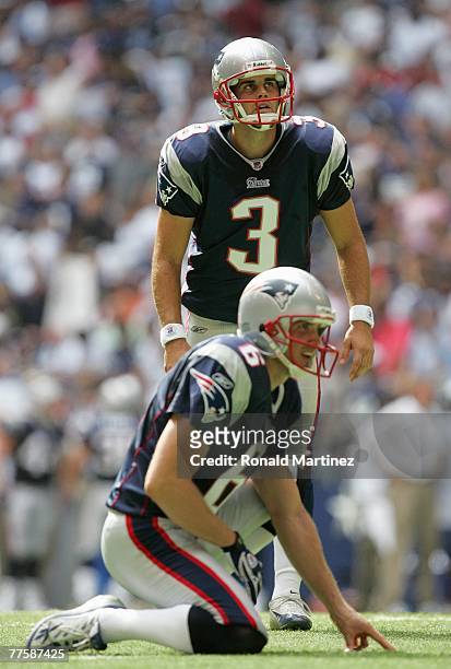 Stephen Gostkowski of the New England Patriots looks to kick a field goal with Chris Hanson during the game against the Dallas Cowboys at Texas...