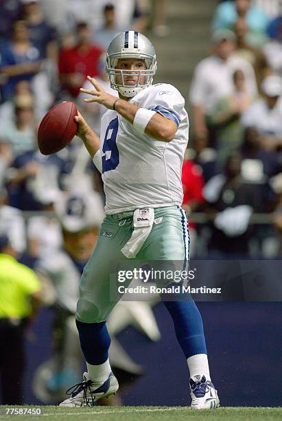 Quarterback Tony Romo of the Dallas Cowboys passes the ball during the game against the New England Patriots at Texas Stadium on October 14, 2007 in...