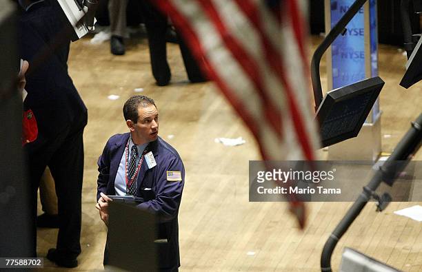 Trader works on the floor of the New York Stock Exchange after the Fed interest rate cut was announced October 31, 2007 in New York City. The Federal...