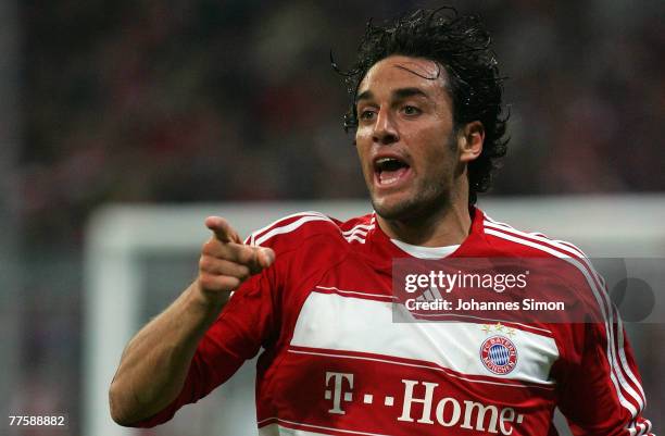 Luca Toni of Munich gestures during the DFB Cup second round match between FC Bayern Munich and Borussia Moenchengladbach at the Allianz Arena on...