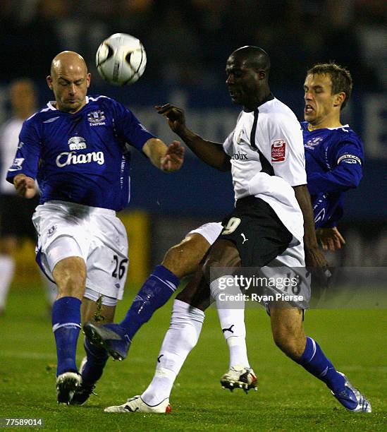 Paul Furlong of Luton Town is tackled by Lee Carsley and Phil Neville of Everton during the Carling Cup Fourth Round match between Luton Town and...