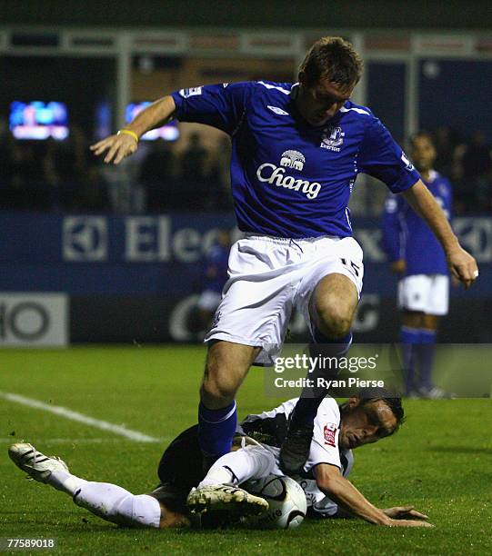 Darren Currie of Luton Town tackles Alan Stubbs of Everton during the Carling Cup Fourth Round match between Luton Town and Everton at Kenilworth...