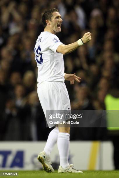 Robbie Keane of Tottenham celebrates scoring the first goal of the game during the Carling Cup match between Tottenham Hotspur and Blackpool at White...