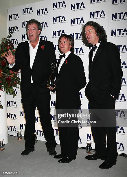 'Top Gear' presenters Jeremy Clarkson, Richard Hammond and James May pose with the award for Most Popular Factual Programme in the Awards Room at the...